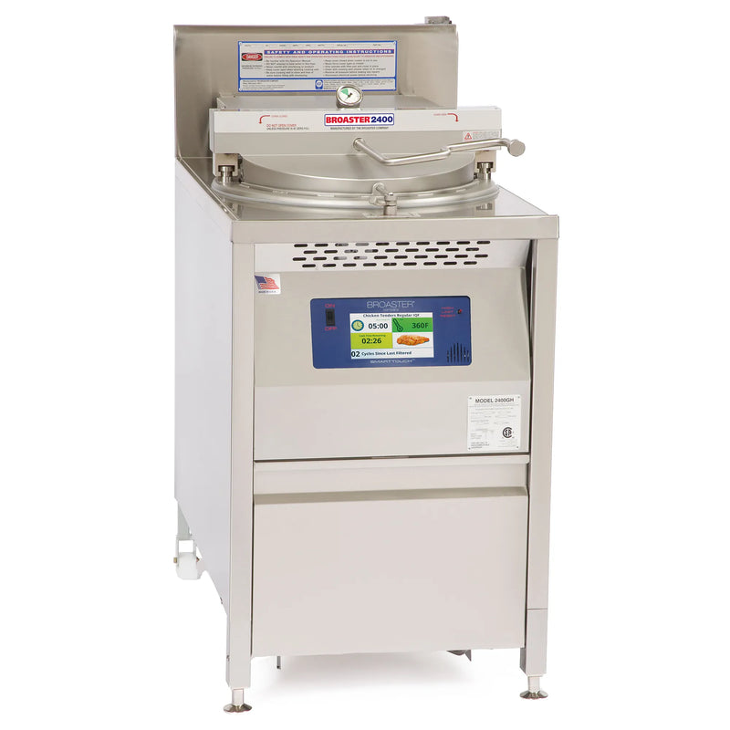 Broaster 2400 series gas pressure fryer in stainless steel with 63 lb capacity and control panel, angled front view
