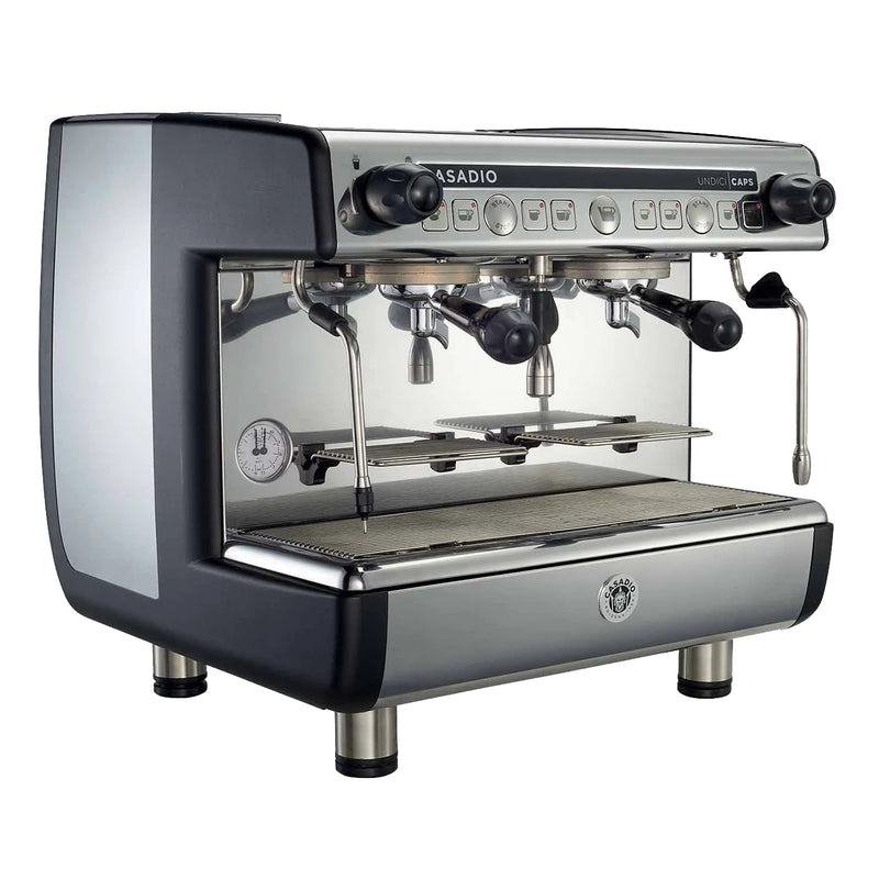 Casadio Nettuno two group espresso machine in black and polished stainless steel with steam wands, angled view