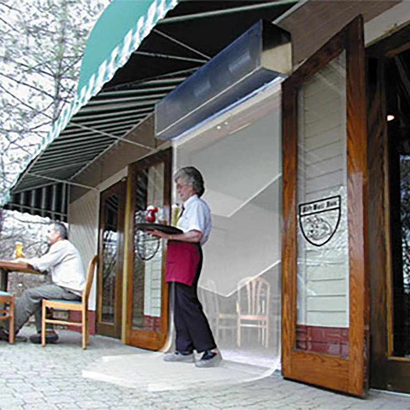 Curtron S-CFD Series front door air curtain installed over a restaurant entrance as a server walks through the door
