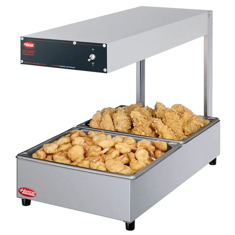 Hatco GRFFL countertop chip dump station with light and overhead heater, shown holding fried chicken in two pans