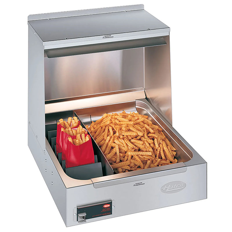 Hatco GRFHS-21 stainless steel fry holding station with overhead heat, shown with french fries and red fry scoop