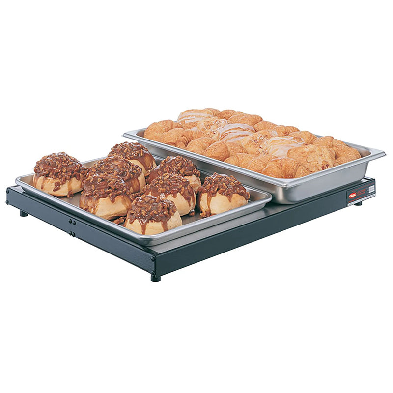 Hatco GRS-24-I countertop 24 inch heated shelf in black shown holding two pans of glazed pastries and donuts