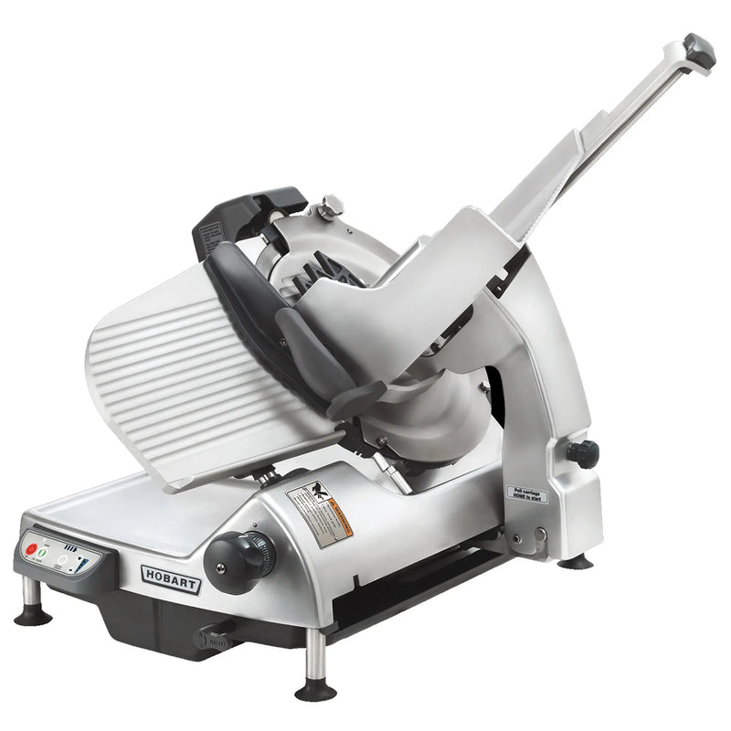 Hobart HS9 Series automatic aluminum meat slicer with 13-inch blade, carriage, pusher arm and black base, angled view