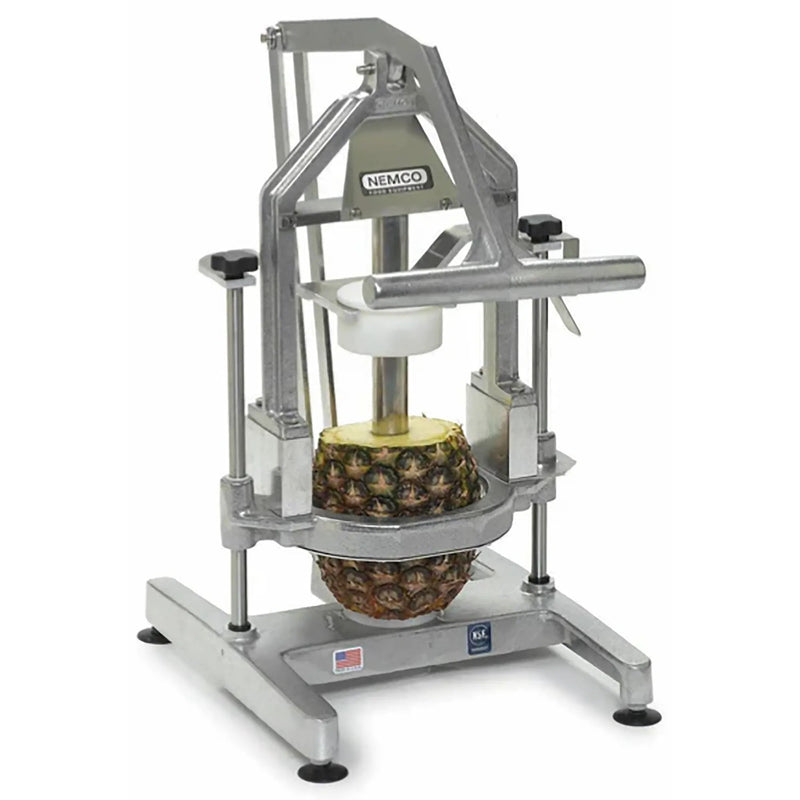 Nemco 55775 series Pineapple Corer/Peeler, aluminum frame with lever pressing down on a whole pineapple