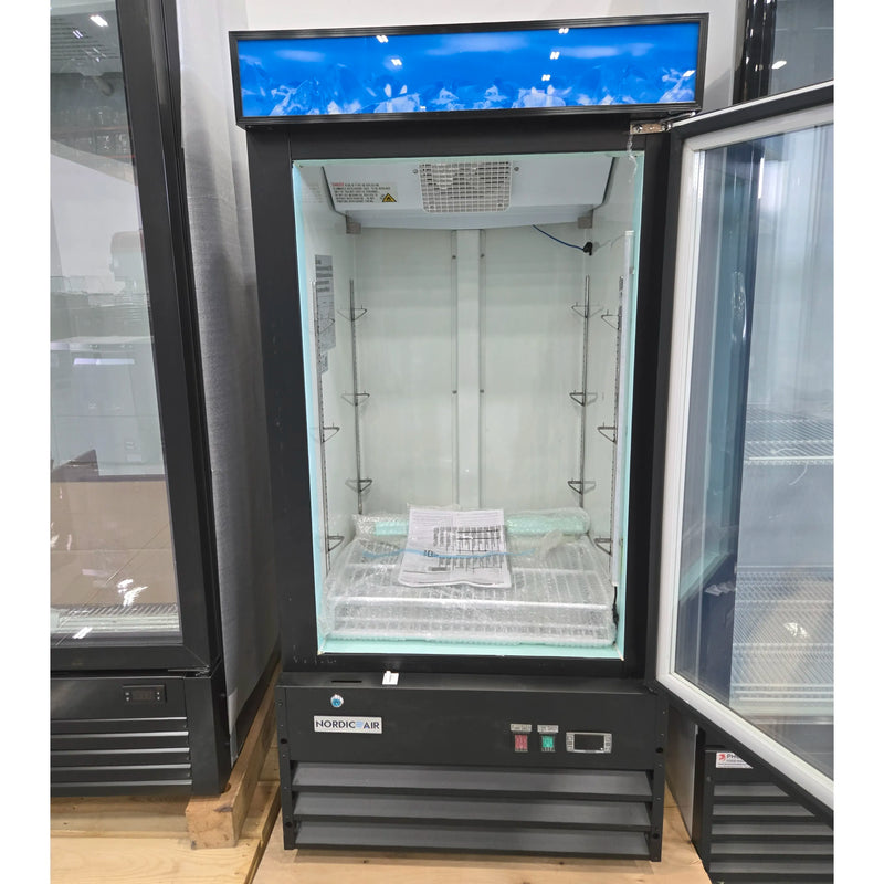 Open box Nordic Air GFM-26 single swing glass door 27-inch display freezer with door open showing interior