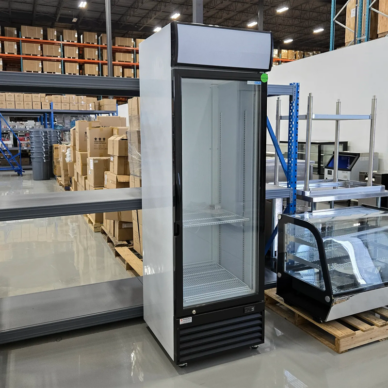 Scratch and dent Duracold P430WA 24-inch single glass door display refrigerator in black and white, angled warehouse view