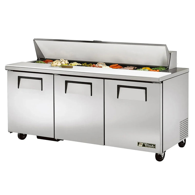 True TSSU-72-18-HC 72" three door stainless steel refrigerated sandwich prep table with lid open over toppings