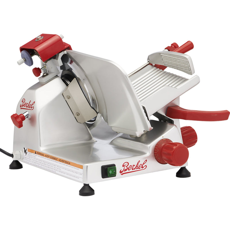 Berkel B9 manual meat slicer with 9-inch blade, aluminum body with red knobs and handles, angled right view