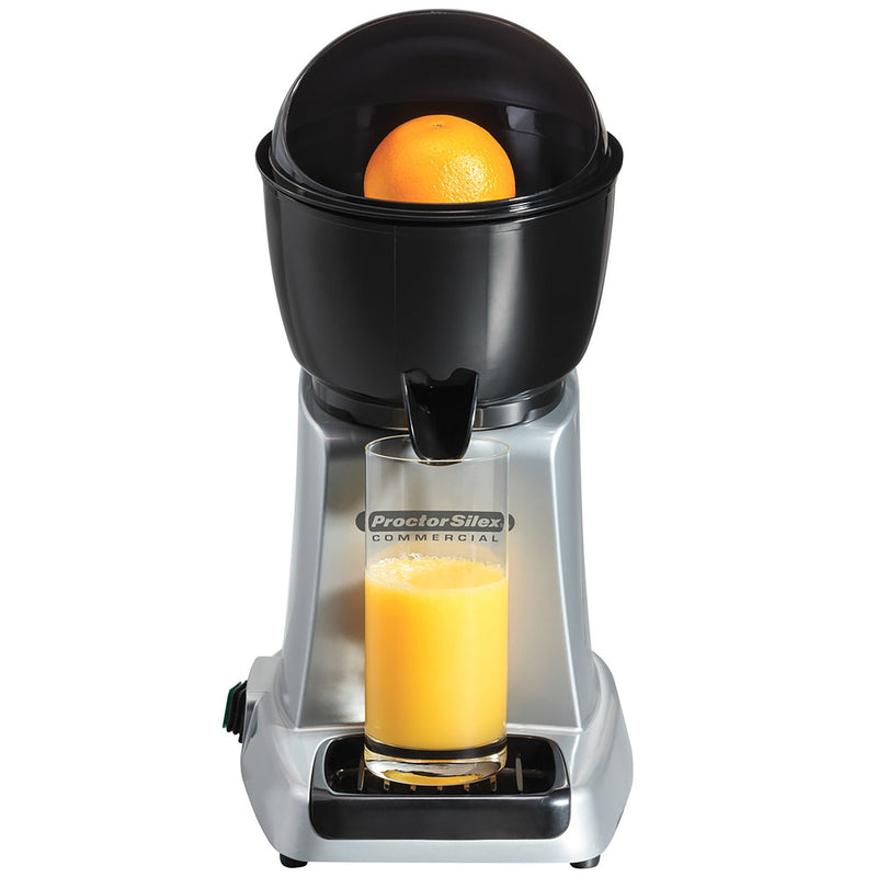 Hamilton Beach 66900 cup size electric citrus juicer in silver and black squeezing an orange into a glass