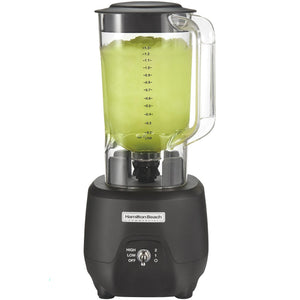 Hamilton Beach HBB908R 44 oz commercial bar blender with clear container of green drink and black base, front