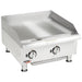 APW Wyott EG-24S heavy duty electric 24-inch griddle in stainless steel with flat steel plate and two knobs, angled view