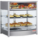 Alpha ADW-107 glass display 26-inch food warmer shown stocked with pastries and baked goods on three shelves