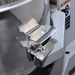 Alpha AVP-20 20 qt planetary stand mixer, close-up of the stainless steel ingredient chute on the bowl guard