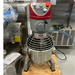 Certified used Alpha AVP-20 20 qt planetary mixer, front view showing the wire bowl guard and stainless steel bowl