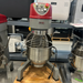 Certified used Alpha AVP-30 30 qt planetary stand mixer on a pallet, front view with the bowl guard and power cord