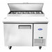 Atosa MPF8201GR 44-inch refrigerated pizza prep table with the insulated lid open over the ingredient pans