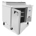 Atosa MPF8201GR 44-inch pizza prep table, angled view with the door open and cutting board work surface