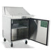 Atosa MSF8301GR 27-inch sandwich prep table with the door open showing the interior wire shelf, angled view