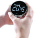 Bios FS711 rotary kitchen timer held in a hand, showing 20 minutes 45 seconds on the backlit digital display