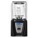 Blendtec 825 Connoisseur commercial blender with clear sound enclosure, black base, and digital display, front view
