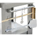 Ciao Bella Primo pizza oven, close-up of the side tool rack holding the pizza peel, brush and hanging utensils