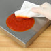 Detecto PZ Series wireless portioning scale, close-up of the stainless steel platform being wiped clean of sauce