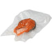 Eurodib channeled vacuum bag shown vacuum sealed around a fresh salmon steak, clear plastic packaging