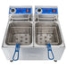 Globe PF32E-C 32 lb electric countertop double well deep fryer with two blue-handled fry baskets, front view