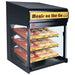 Hatco FS3HAC-2426 heated 24 inch pass through station shown merchandising packaged grab-and-go meals on shelves