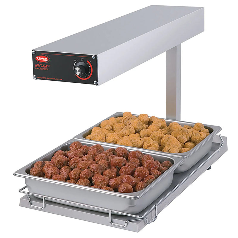 Hatco GRFFB countertop chip dump station with light, heats from above and below, shown holding meatballs