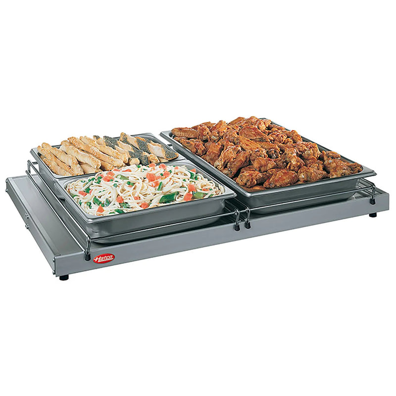 Hatco GRS-30-I countertop 30 inch heated shelf in aluminum shown holding two pans of rice and fried chicken
