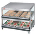Hatco GRSDS-30D merchandising 30 inch double shelf warmer in aluminum with sandwiches and pizza boxes on shelves