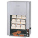 Hatco TK-100 vertical toaster in stainless steel with bread slices on the conveyor racks and toast in front tray