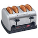Hatco TPT-208 commercial 4 slot pop-up toaster in stainless steel shown with toasted buns in all four slots