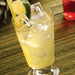Hoshizaki AM-50BAJ under counter ice machine, top hat cube ice in a glass of lemonade with a lime wedge