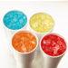 Hoshizaki F-1002MAJ-C modular ice machine, cubelet ice in four cups with blue, yellow, orange and red syrup