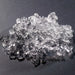 Hoshizaki F-1501MAJ modular ice machine, close-up of a pile of clear flake shaped ice on a dark surface