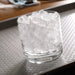Hoshizaki F-422MAK-C modular ice machine, clear glass filled with cubelet shaped nugget ice on a bar top