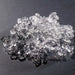 Hoshizaki F-422MAK modular ice machine, close-up of a pile of clear flake shaped ice on a dark surface