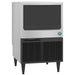 Hoshizaki KM-116BAK under counter crescent ice machine in stainless steel with black grille, angled front view