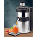 Juicernet ES500 Ceado fruit and vegetable juicer dispensing fresh juice into a glass beside carrots and oranges