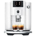 Jura E6 residential automatic coffee machine in piano white with colour display, front view with two espressos