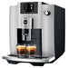 Jura E6 residential automatic coffee machine in platinum, angled right view with two espressos under the spout