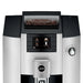 Jura E6 residential automatic coffee machine, elevated front view of the bean container, display and rotary dial