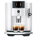 Jura E8 residential automatic coffee machine in piano white with colour display, front view with two espressos