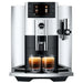 Jura E8 residential automatic coffee machine in chrome with colour display, front view brewing two espressos