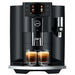 Jura E8 residential automatic coffee machine in piano black with colour display, front view brewing two espressos