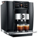Jura GIGA 10 residential automatic coffee machine in black, angled left view with two espressos on the drip tray