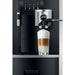 Jura GIGA X8 commercial automatic coffee machine, close-up of the height-adjustable spout pouring a latte macchiato