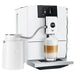 Jura glass milk carafe for automatic coffee machines, 16.9 oz, white milk container next to a white Jura machine